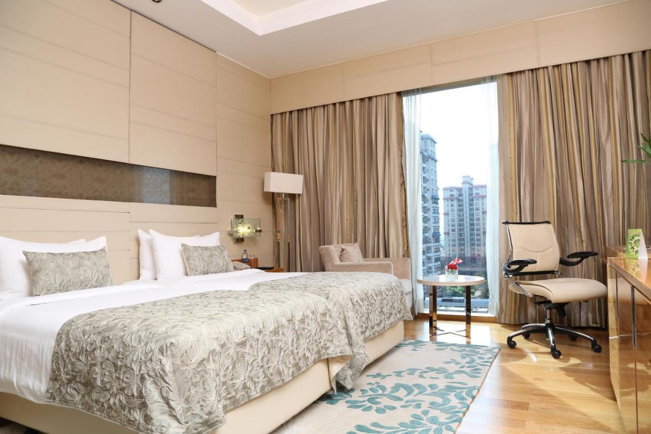 ทัช ซิตี้เซ็นเตอร์ - คุรุคราม Hotel คูร์เคาน์ ภายนอก รูปภาพ A room at the hotel